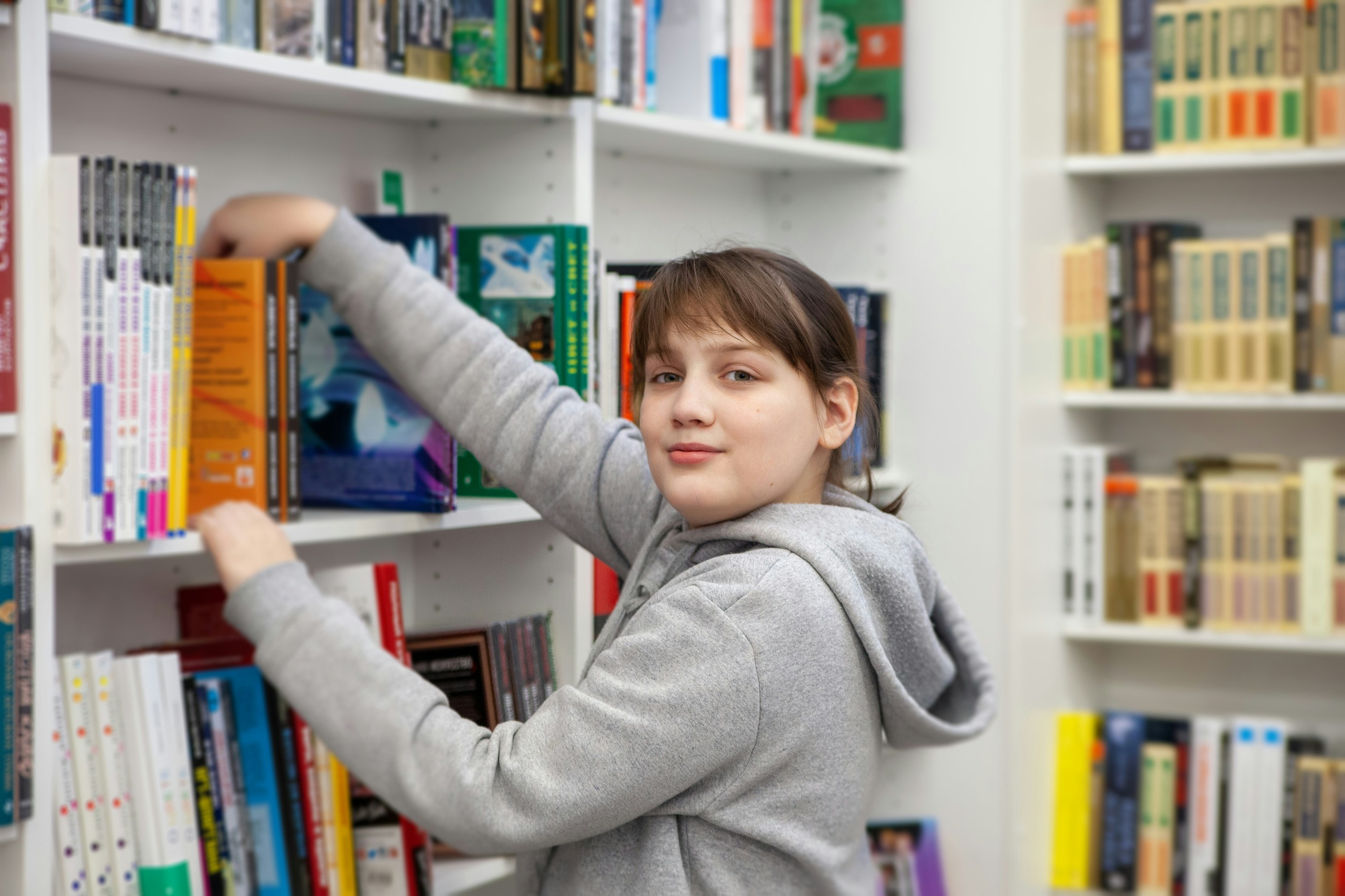 a boy holding a book